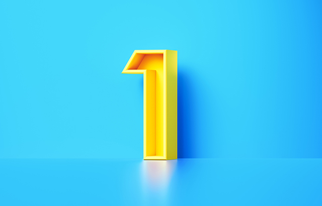 Yellow number one sitting on blue background.