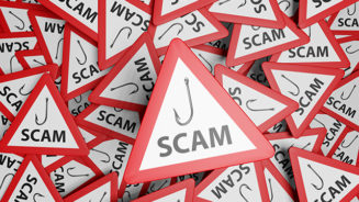 Red warning triangle with white background and black symbol showing a fishing hook and the word SCAM. Illustration of the concept of cyber scam and email phishing