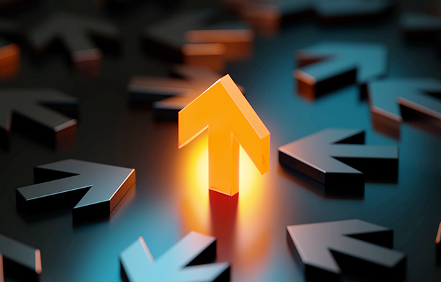 Arrow symbol glowing amid black arrow symbols on black background. Horizontal composition with copy space. Stock market and finance concept.