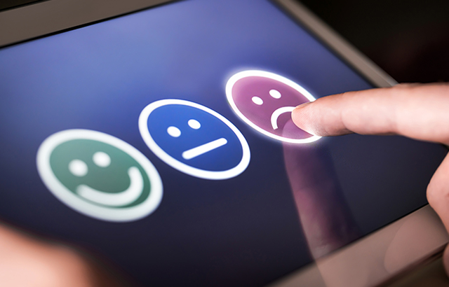 Unhappy and disappointed customer giving low rating and negative feedback in survey, poll or questionnaire. Sad and dissatisfied man giving review about service quality. Bad user experience.