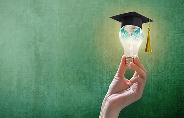 Innovative learning, creative educational study concept for graduation and school student success with world lightbulb on teacher chalkboard