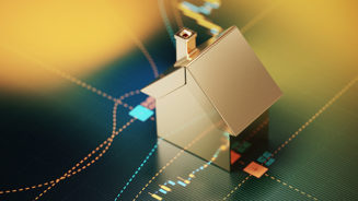 House symbol sitting over a bar graph. Selective focus. Horizontal composition with copy space. Mortgage and finance concept.